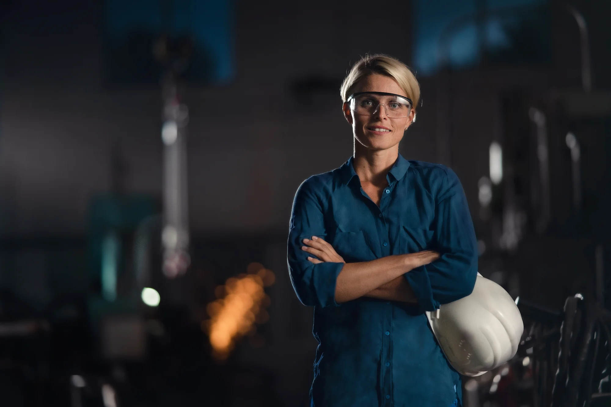 confident-woman-in-industrial-setting-with-safety-2026-09-22-17-54-54-utc